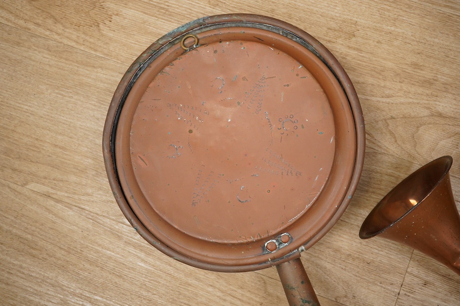 Victorian copper, including a two handled preserve pan, a copper hunting horn, a helmet coal scuttle and a warming pan. Scuttle 32cm high. Condition - hunting horn dented